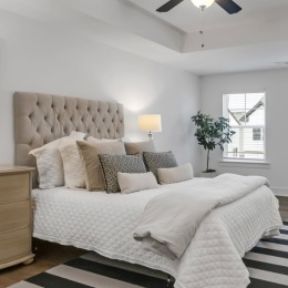 cozy bed with decorative pillows