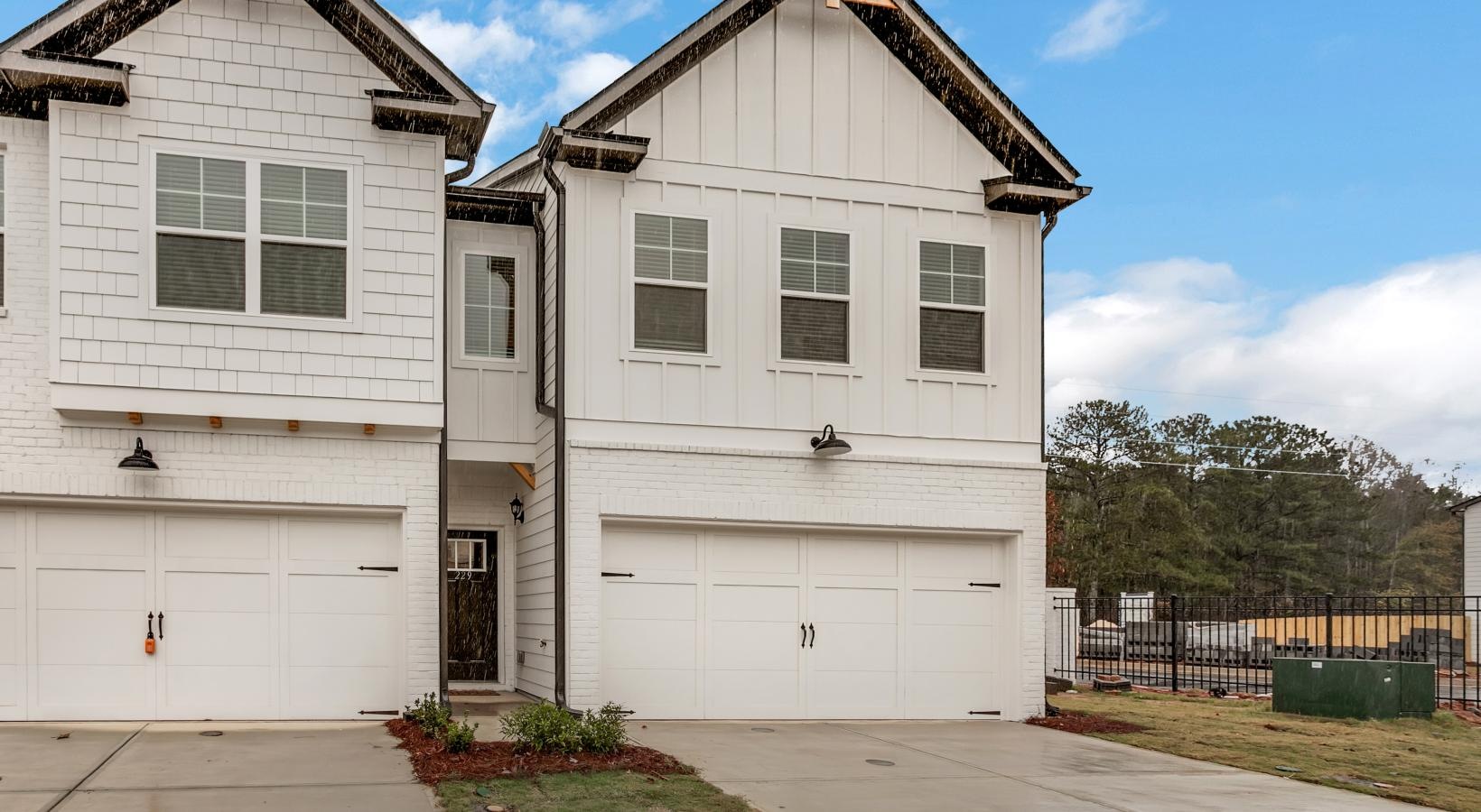 The essence of exceptional living a white house with a garage