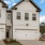a white house with a garage