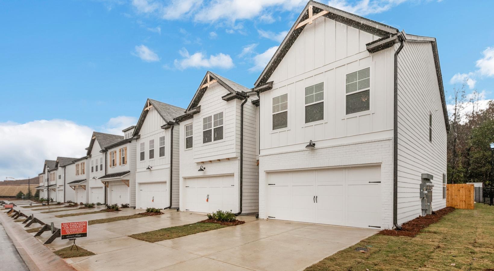 Settle into comfort at Centennial Ridge a row of white buildings