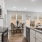 a kitchen with a table and chairs