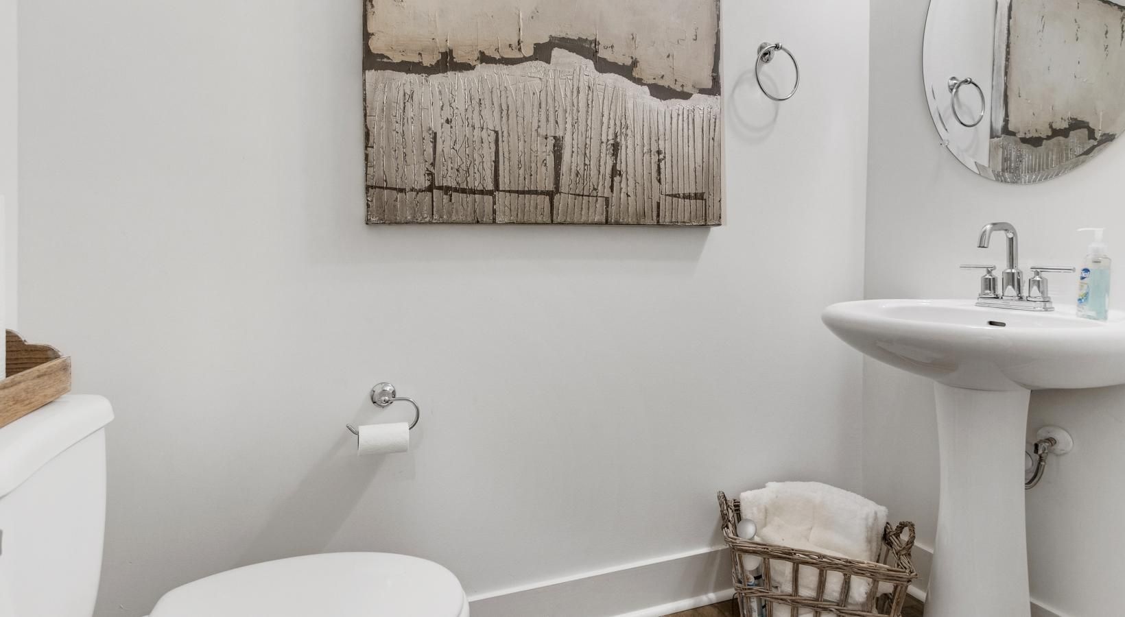 Bathroom options with thoughtful details a bathroom with a toilet mirror and sink