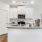 a kitchen with white cabinets