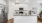a kitchen with white cabinets