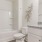 a bathroom with a tub toilet and sink