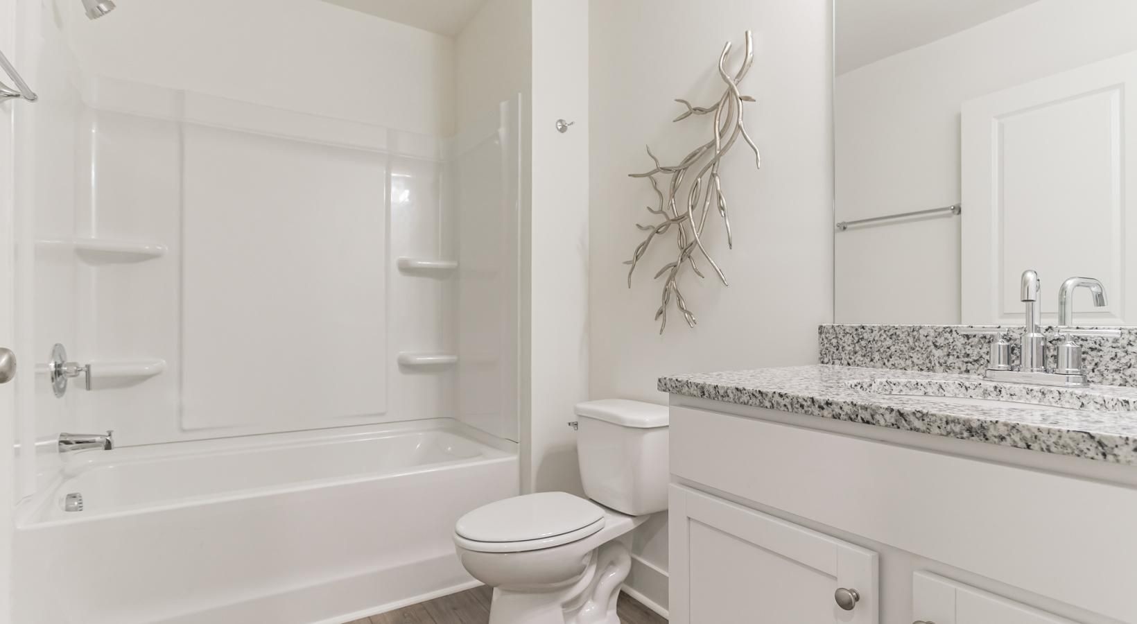 Bathroom options with thoughtful details a bathroom with a tub toilet and sink