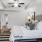 a bedroom with a bed and lamps