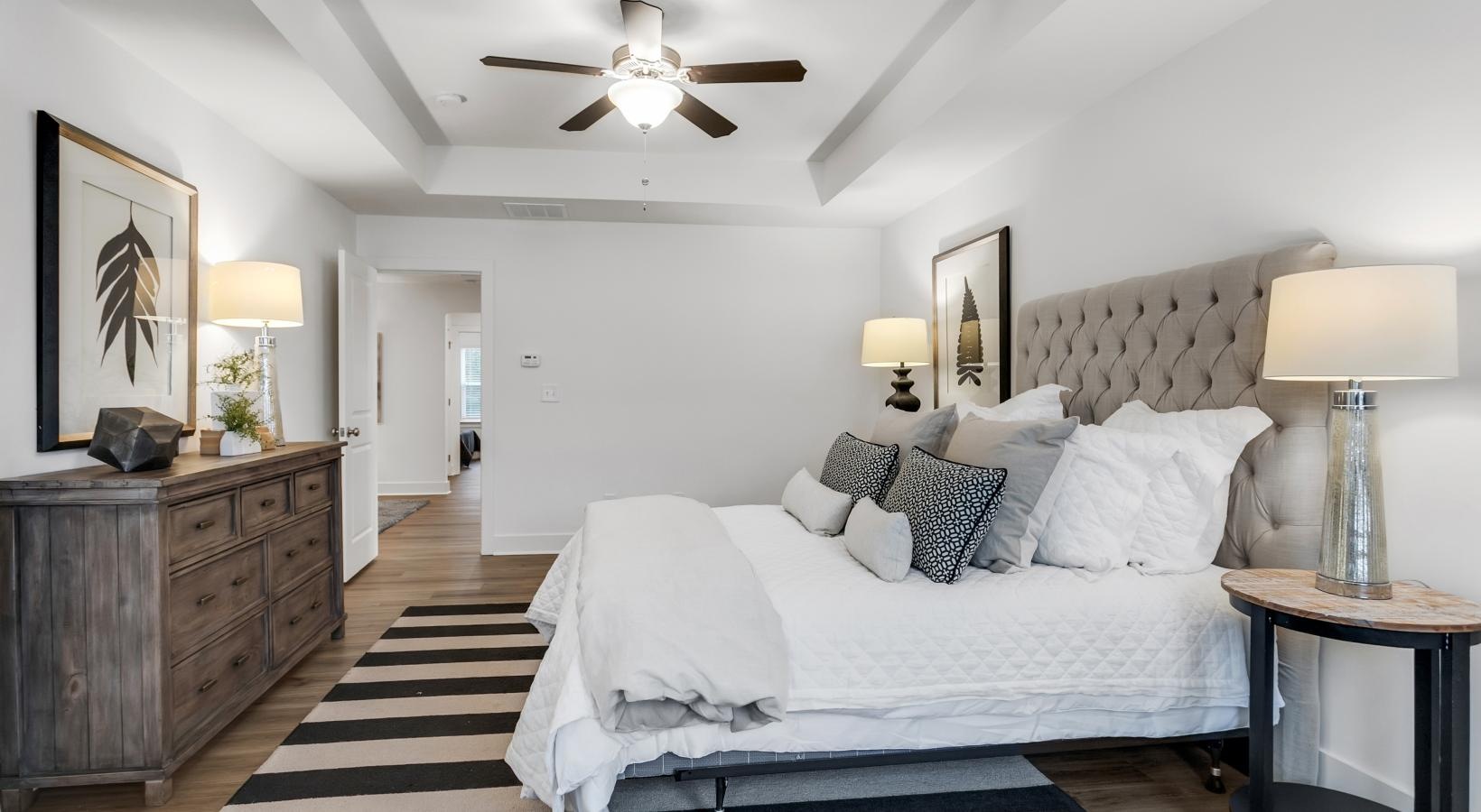 Beautiful bedrooms to fit every need a bedroom with a bed and lamps